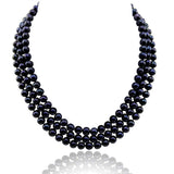 Three rows of dyed-black 6.5–7.5mm Freshwater cultured pearls with blue-violet highlights, shown in a curved drape.