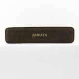Closed long rectangular black AKWAYA jewelry presentation case on a white background.